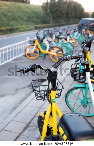 Shared bicycles\
parked on the side of the\
road