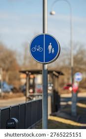 Shared pedestrian and bicycle path traffic sign on urban street