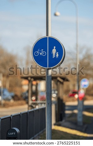 Shared pedestrian and bicycle path traffic sign on urban street