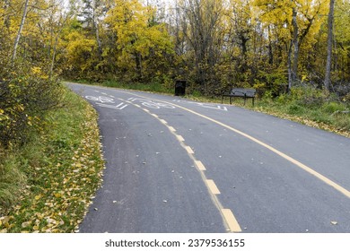 Shared-use path for cyclists and pedestrians in fall season