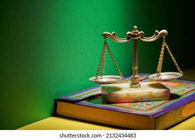 sharia law - libra scale and holy koran 