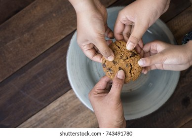 sharing concept - family sharing cookies - Shutterstock ID 743491780