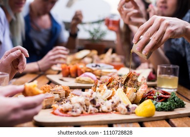 Sharing Food Platters With Friends