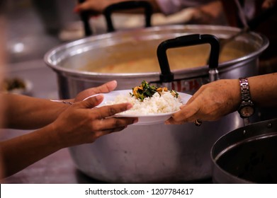 Sharing Of Food From Volunteer Hands To Homeless People : The Concept Of Feeding