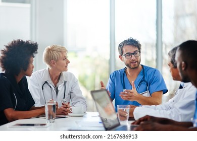 Sharing Medical Expertise For The Best Possible Outcome. Shot Of A Team Of Doctors Having A Meeting In A Hospital.