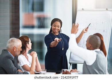 Sharing Some Constructive Feedback. Cropped Shot Of A Businesswoman Giving A Presentation To Her Colleagues In A Boardroom.