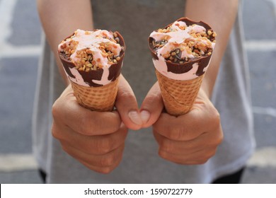 Sharing Two Ice Cream Cones.  Hands Holding Ice Cream Cones. Giving Is Caring. Lovely Pictures.