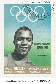 SHARJAH - CIRCA 1968: A Stamp Printed In Sharjah, Shows Portrait Of James Cleveland Owens (1913-1980) American Track And Field Athlete, He Participated In 1936 Summer Olympics In Berlin, Circa 1968