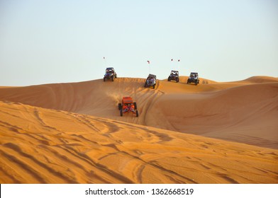 Sharjah Desert Dubai, United Arab Emirates - 20.2.2012:  Tourists Driving Dune Buggy In Desert Near Dubai, UAE