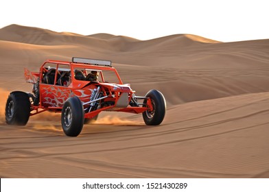 Sharjah Desert Dubai, United Arab Emirates - 20.2.2012:  Tourist Driving Dune Buggy In Desert Near Dubai, UAE