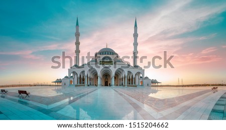 Sharjah Mosque Largest Masjid in Dubai, Ramadan Eid Concept background, Arabic Letter means: Indeed, prayer has been decreed upon the believers a decree of specified times, Travel and tourism image