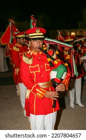 SHARJAH, UAE - APRIL 14, 2005: A Piper Of The UAE Military Band Playing His Bagpipes During Sharjah's Heritage Days Festival.