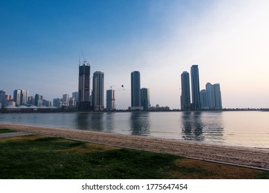 Sharjah, UAE, July 12, 2020. Panoramic view of Sharjah Corniche in AL Khan. Modern skyscrapers on the background. Buhairah lake.  - Shutterstock ID 1775647454