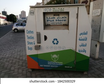 Sharjah, UAE - October 28, 2020: An Islamic Charity Organization's Metal Box On A Street Corner For Donation Drop Off Of Clothes, Textiles, Shoes And Bags For Needy People In The Arabian Gulf.