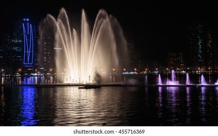 SHARJAH, UAE - OCTOBER 29, 2013: Musical fountain show. The Sharjah Fountain is one of the biggest fountains in the region.