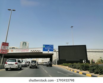 Sharjah, United Arab Emirates - August 14, 2020: Outdoor Advertising Digital Billboard/hoarding Prominently Located On A City Street To Gain Motorists' Attention.