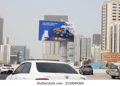 Sharjah, United Arab Emirates - March 7, 2022: Large Outdoor Advertising Display (unipole Billboard) Located On A Major Highway In Sharjah City. Out Of Home Advertising Concept.