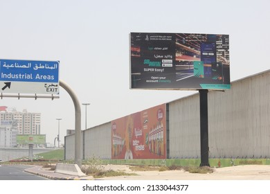 Sharjah, United Arab Emirates - March 7, 2022: Large Outdoor Advertising Display (unipole Billboard) Located On A Major Highway In Sharjah City. Out Of Home Advertising Concept.