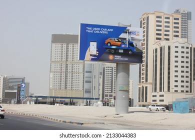 Sharjah, United Arab Emirates - March 7, 2022: Large Outdoor Advertising Display (unipole Billboard) Located On A Major Highway In Sharjah City. Out Of Home Advertising Concept.