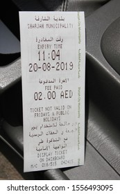 Sharjah, United Arab Emirates - November 11, 2019: A Sharjah Municipality Paid Parking Ticket Costs US$0.54 (AED2) For A 1-hour Period And Can Be Bought From Roadside Parking Meter Vending Machines.