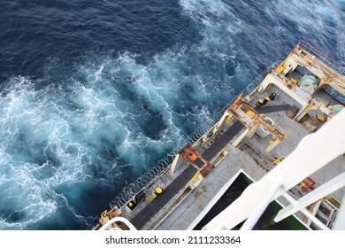 Sharp Barbed Wire Or Razor Wire Attached To The Ship Hull, Superstructure And Railings To Protect The Crew Against Piracy Attack Passing Gulf Of Guinea In West Africa. Areal Or High Angle View. 