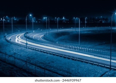 sharp bend of the road, long exposure of car lights at night