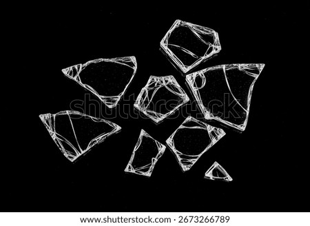 Sharp Broken Glass Shards Isolated on a Solid Black Background