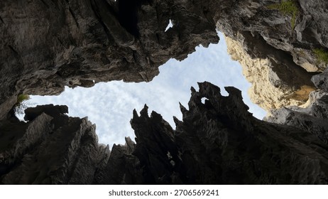 sharp cliffs, geographical formations, shaped stones and dark pits