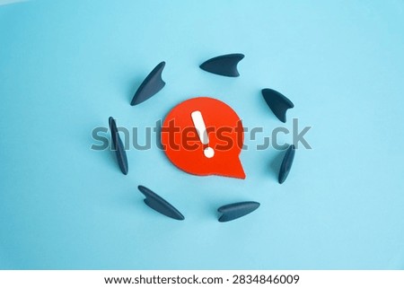 Sharp comment surrounded by shark fins. Harsh criticism and risk of backlash. Unpopular opinions can trigger attacks, controversy and public pressure.
