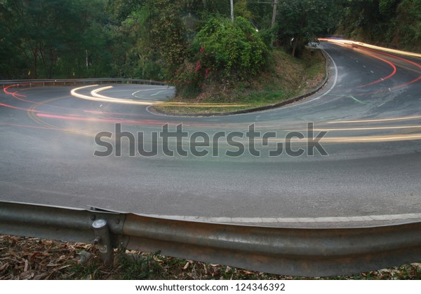 sharp curve road with car
light line