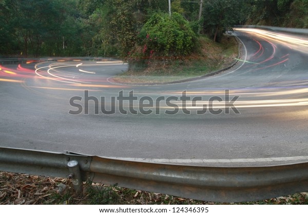 sharp curve road with car\
light line