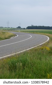 sharp curve in summer fields