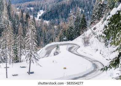 Sharp Curves On A Snowy Mountain Road. Treacherous Driving Conditions