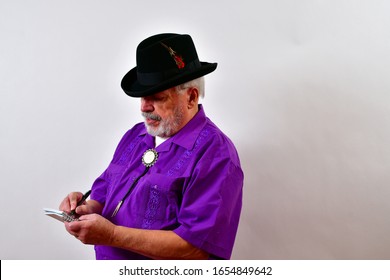 Sharp Dressed Gentleman Taking Notes.
  Older Man Writing In His Notebook.