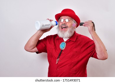 Sharp Dressed Hipster Is Drinking Bleach And Shining A UV Lamp Into His Ear. Treating COVID-19 Infection.

Gullible Old Man Is Taking Dangerous And Fake Medical Advice.