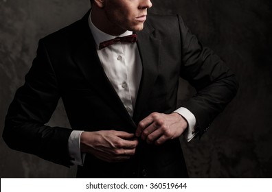 Sharp Dressed Man Wearing Jacket And Bow Tie