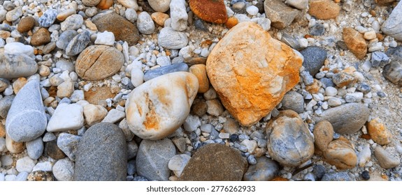 Sharp focus on smooth-surfaced river rocks for tactile surface material analysis