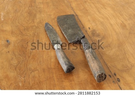 A sharp kitchen knife with a unique shape