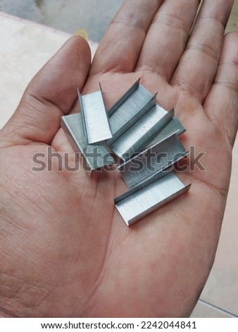 sharp metal stepler refill on the hand 