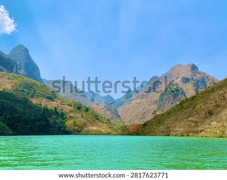 Sharp Mountain Peak Above the Turquoise Waters of the Nho Que River in Ha Giang, Vietnam