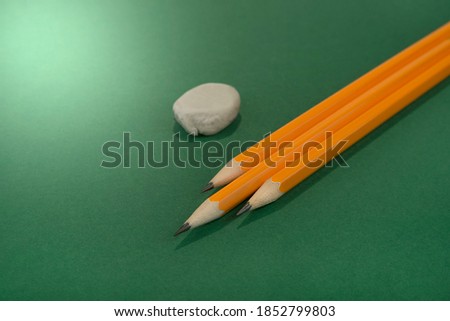 Sharp pensils on a grenn background
