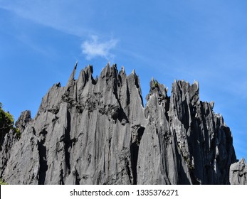 Sharp Pointed Edges Of A Rock Formation Under A Blue Sky.