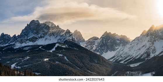 The sharp ridges of the Tre Cime mountain range and UNESCO World Heritage site before a winter sunset.  - Powered by Shutterstock