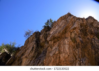 Sharp Rock Formation With Sun