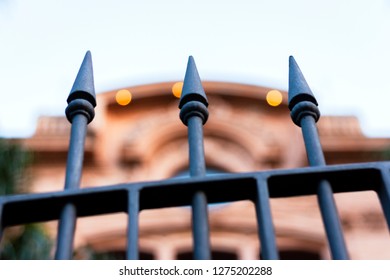 Sharp steel bars in a decorative fence in the street of Catania, Sicily, Italy