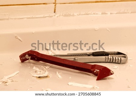 Sharp tools, knives used to remove old silicone in the bathroom