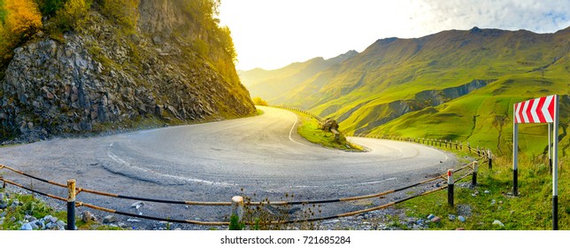 A Sharp Turn On A Beautiful Mountain Road At Sunset