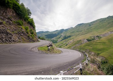 A Sharp Turn On The Georgian Military Road In The Mountains.