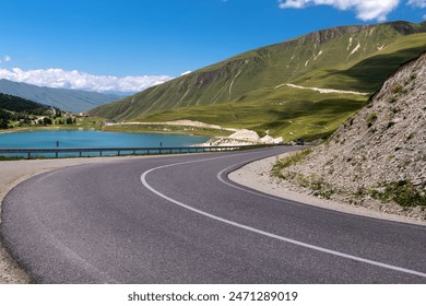 A sharp turn on a mountain road. Serpentine. Car winding road in beautiful mountains. Caucasus. Chechen Republic, Russia