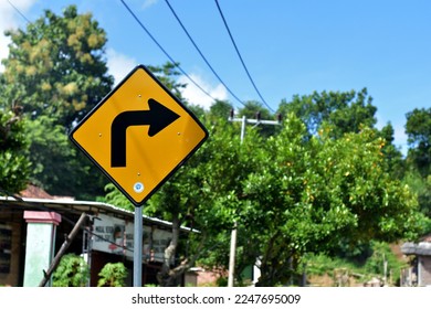 Sharp turn right. Beware! DINAS PERHUBUNGAN KAB. BOJONEGORO Means DEPARTMENT OF TRANSPORTATION. BOJONEGORO DISTRICT.